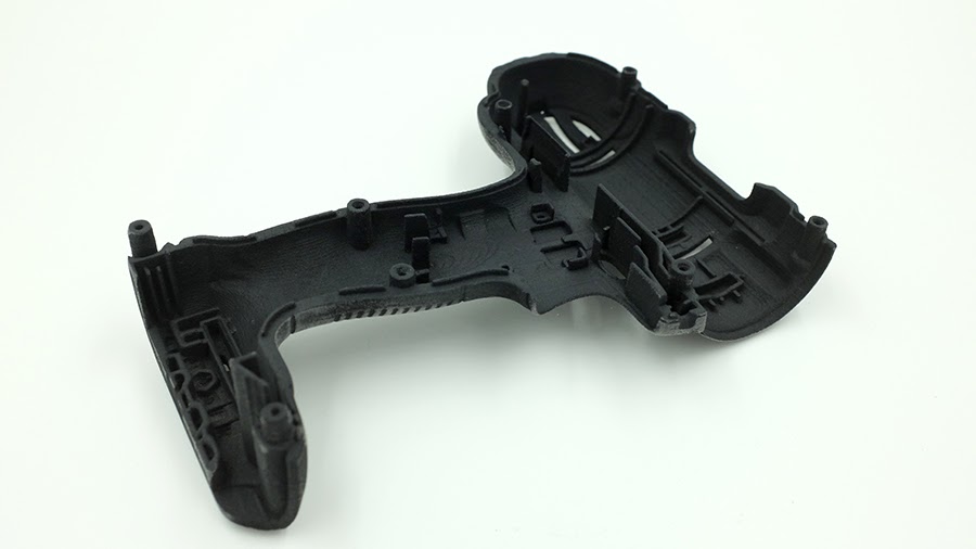 Black dyed SLS nylon drill housing demonstrating deep color penetration